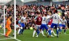 Burnley's Chris Wood scores his side's first goal of the game during their English Premier League soccer match against Cardiff City at Turf Moor, Burnley, England, Saturday, April 13, 2019. (Anthony Devlin/PA via AP)