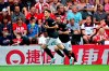 Manchester United's Daniel James, left, celebrates scoring his side's first goal of the game during their English Premier League soccer match against Southampton at St Mary's, Southampton, England, Saturday, Aug. 31, 2019. (Mark Kerton/PA via AP)