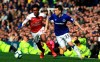 Arsenal's Alex Iwobi, left, and Everton's Seamus Coleman battle for the ball during their English Premier League soccer match at Goodison Park, Liverpool, England, Sunday, April 7, 2019. (Peter Byrne/PA via AP)