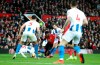 Brighton & Hove Albion's Gaetan Bong, center left, fouls Manchester United's Paul Pogba, center, resulting in a penalty during the English Premier League soccer match between Manchester United and Brighton at Old Trafford, Manchester, England, Saturday, Jan. 19, 2019. (Martin Rickett/AP via AP)