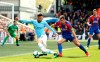 Manchester City's David Silva, left, and Crystal Palace's James McArthur battle for the ball during their English Premier League soccer match at Selhurst Park, London, Sunday, April 14, 2019. (Steven Paston/PA via AP)