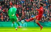 Burnley goalkeeper Thomas Heaton, left, and Liverpool's Mohamed Salah in action during the English Premier League soccer match between Liverpool and Burnley at Anfield, Liverpool, England, Sunday, March 10, 2019. (Peter Byrne/PA via AP)