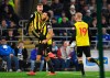 Watford's Gerard Deulofeu, left, celebrates scoring his side's second goal of the game with teammates Troy Deeney and Will Hughes, right, during the English Premier League soccer match between Cardiff City and Watford at the Cardiff City Stadium, Wales, Friday, Feb. 22, 2019. (Simon Galloway/PA via AP)