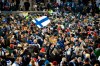 Finnish fans join players to celebrate their victory in the Euro 2020 Group J qualifying soccer match between Finland and Liechtenstein in Helsinki, Finland, on Friday, Nov. 15, 2019. Finland won 3-0 and have qualified for a major soccer tournament for the first time in their history. (Martti Kainuleinen/Lehtikuva via AP)