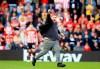 A fan runs on the pitch during the English Premier Leagues soccer match between Southampton and Huddersfield at St Mary's Stadium, Southampton, England, Sunday, May 12, 2019. (Adam Davy/PA via AP)