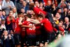 Manchester United's Juan Mata, center obscured, celebrates scoring his side's first goal of the game with teammates during their English Premier League soccer match against Chelsea at Old Trafford, Manchester, England, Sunday, April 28, 2019. (Martin Rickett/PA via AP)