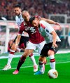 Torino's Lorenzo De Silvestri, left, and Milan's Theo Hernandez in action during the Italian Serie A soccer match between Torino FC and AC Milan at the Olimpico Grande Torino stadium in Turin, Italy, Thursday, Sept. 26 2019. (Alessandro Di Marco/ANSA via AP)