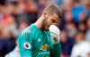 Manchester United goalkeeper David de Gea appears dejected after their English Premier League soccer match against Chelsea at Old Trafford, Manchester, England, Sunday, April 28, 2019. The game ended in a 1-1 draw. (Martin Rickett/PA via AP)