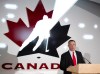 Kevin Dineen addresses a Hockey Canada news conference announcing him as the new head coach of Canada's National Women's Team in Calgary, Alta., Tuesday, December 17, 2013. THE CANADIAN PRESS/Larry MacDougal