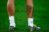 Bayern defender Rafinha's tattoos are seen in the warm-up before the Champions League round of 16 first leg soccer match between Liverpool and Bayern Munich at Anfield stadium in Liverpool, England, Tuesday, Feb. 19, 2019. (AP Photo/Dave Thompson)