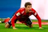 FILE - In this Saturday, Nov. 24, 2018 file photo, Bayern's Thomas Mueller protests during the German Bundesliga soccer match between FC Bayern Munich and Fortuna Duesseldorf in Munich, Germany. Bayern Munich forward Thomas Mueller has been banned for both games against Liverpool in the Champions League round of 16. UEFA says its disciplinary panel imposed a two-game ban for Mueller's red card after a bad tackle against Ajax last month. (AP Photo/Matthias Schrader, File)