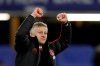 FILE - In this Monday, Feb. 18, 2019 file photo, Manchester United caretaker head coach Ole Gunnar Solskjaer applauds fans at the end of the English FA Cup fifth round soccer match between Chelsea and Manchester United at Stamford Bridge stadium in London. Manchester United on Thursday March 28, 2019, made coach Ole Gunnar Solskjaer a permanent hire, with a three-year contract. (AP Photo/Matt Dunham, File)