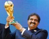 FILE - In this Thursday Dec. 2, 2010 file photo, Sheikh Hamad bin Khalifa Al-Thani, Emir of Qatar, holds the World Cup trophy after the announcement of Qatar hosting the 2022 soccer World Cup in Zurich, Switzerland. FIFA has been plunged into crisis since seven officials were arrested in dawn raids last week at a luxury Zurich hotel and in a separate probe, Swiss authorities are investigating the 2018 and 2022 World Cup bidding contests, which went to Russia and Qatar. (AP Photo/Anja Niedringhaus, File)