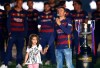 FILE - In this file photo dated Monday, May 23, 2016, Barcelona coach Luis Enrique holds the hand of his daughter Xana, celebrating with teammates winning the Copa del Rey and Spanish league title, at the Camp Nou stadium in Barcelona, Spain. Enrique posted a message on Twitter Thursday Aug. 29, 2019, saying his 9-year old daughter Xana has died after a five-month battle against a type of bone cancer. (AP Photo/Manu Fernandez, FILE)