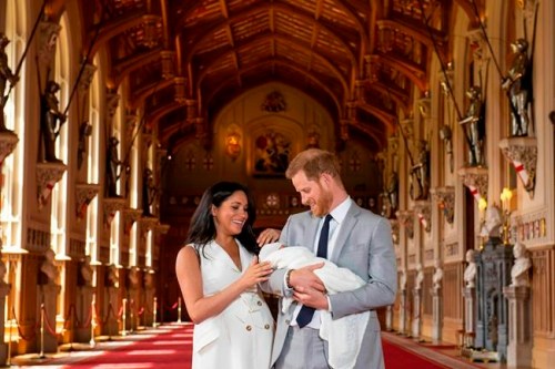 Britain's Prince Harry and Meghan, Duchess of Sussex, during a photocall with their newborn son, in St George's Hall at Windsor Castle, Windsor, south England, Wednesday May 8, 2019. Baby Sussex was born Monday at 5:26 a.m. (0426 GMT; 12:26 a.m. EDT) at an as-yet-undisclosed location. An overjoyed Harry said he and Meghan are 