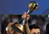 FILE - In this file photo dated Saturday, Dec. 22, 2018, Real Madrid's Marcelo holds the trophy after winning the Club World Cup final soccer match against Al Ain at Zayed Sport City in Abu Dhabi, United Arab Emirates. FIFA selected China as host of the inaugural edition of the expanded Club World Cup to be played in 2021, it is announced Thursday Oct. 24, 2019, but delayed a decision on how the 24 slots for the tournament will be distributed. (AP Photo/Kamran Jebreili, FILE)