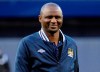 FILE - In this Friday, May 17, 2013 file photo, Patrick Vieira smiles after throwing out the first pitch before the New York Yankees and Toronto Blue Jays play a baseball game, at Yankee Stadium in New York. Nice coach Patrick Vieira took the rare step of publicly criticizing his player Allan Saint-Maximin after the winger declared himself unfit to play at Angers, Saturday Feb. 16, 2019. (AP Photo/Bill Kostroun, FILE)