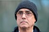 FILE - In this Tuesday, Dec. 26, 2017 file photo, Manuel Burga leaves federal court in the Brooklyn borough of New York. Manuel Burga, a South American soccer official acquitted of racketeering in the United States, has been banned for life by FIFA for taking bribes. (AP Photo/Seth Wenig, File)