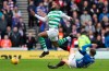 Celtic's Olivier Ntcham, left, and Rangers' Andrew Halliday clash during their Scottish Premiership soccer match at Ibrox Stadium in Glasgow, Scotland, Saturday Dec. 29, 2018. (Andrew Milligan/PA via AP)
