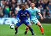 Cardiff City's Junior Hoilett, left, and Chelsea's Cesar Azpilicueta in action during their English Premier League soccer match at the Cardiff City Stadium, in Cardiff, Wales, Sunday March 31, 2019. (Nick Potts/PA via AP)