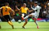 Wolverhampton Wanderers' Ryan Bennett and Fulham's Tom Cairney, right, battle for the ball during the English Premier League soccer match at Molineux, Wolverhampton, England, Saturday May 4, 2019. (Nick Potts/PA via AP)