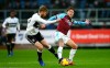 Fulham's Tim Ream, left, and Burnley's Jeff Hendrick battle for the ball during the English Premier League soccer match between Burnley F.C and Fulham at the Turf Moor stadium, Burnley, England. Saturday, Jan. 12, 2019. (Dave Thompson/PA via AP)
