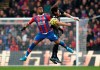 Crystal Palace's Jordan Ayew, left, and Leicester City's Caglar Soyuncu battle for the ball during the English Premier League soccer match at Selhurst Park, London, Sunday Nov. 3, 2019. (John Walton/PA via AP)
