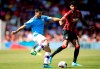 Manchester City's Ilkay Gundogan, left, and Bournemouth's Philip Billing battle for the ball during the English Premier League soccer match between Bournemouth and Manchester City at the Vitality Stadium, Bournemouth, England, Sunday Aug. 25, 2019. (Adam Davy/PA via AP)