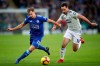 Leicester City's Marc Albrighton, left, and Cardiff City's Greg Cunningham during their English Premier League soccer match at the King Power Stadium in Leicester, England, Saturday Dec. 29, 2018. (Nick Potts/PA via AP)