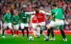 Arsenal's Alexandre Lacazette, left, and Brighton & Hove Albion's Lewis Dunk battle for the ball during the English Premier League soccer match at the Emirates Stadium, London, Sunday May 5, 2019. (John Walton/PA via AP)