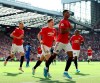 Manchester United's Marcus Rashford celebrates scoring his side's first goal of the game from the penalty spot during the English Premier League soccer match between Manchester United and Leicester City at Old Trafford Stadium, Manchester England. Saturday, Sept. 14 2019 (Martin Rickett/PA via AP)