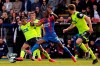 Huddersfield Town's Juninho Bacuna, left, and Crystal Palace's Michy Batshuayi tussle for the ball during the English Premier League soccer match between Crystal Palace and Huddersfield at the Selhurst Park stadium, London. Saturday, March. 30, 2019 (Isabel Infantes/PA via AP)