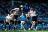 Manchester United's Victor Lindelof, left, and teammate Nemanja Matic battle for the ball with Everton's Kurt Zouma during the English Premier League soccer match at Goodison Park, Liverpool, England, Sunday April 21, 2019. (Martin Rickett/PA via AP)