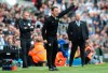 Fulham manager Scott Parker, centre, and Newcastle United manager Rafael Benitez, right, during the English Premier League soccer match between Fulham and Newcastle United at the Craven Cottage stadium, London. Sunday May 12, 2019 (Jonathan Brady/PA via AP)