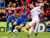 Crystal Palace's Luka Milivojevic, left, and Everton's Morgan Schneiderlin vie for the ball during the English Premier League soccer match between Crystal Palace and Everton at Selhurst Park, London. Saturday, April 27, 2019. (Isabel Infantes/PA via AP)