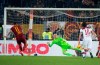 Roma's Aleksandar Kolarov, left, scores a goal from a penalty against Bologna, during Italian Serie A soccer match between AS Roma and Bologna FC at Olimpico stadium in Rome, Italy, Monday Feb. 18, 2019. (Maurizio Brambatti/ANSA via AP)