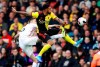 Sheffield United's Chris Basham, left, and Watford's Andre Gray battle for the ball during the English Premier League soccer match at Vicarage Road, Watford, England, Saturday Oct. 5, 2019. (Ian Walton/PA via AP)