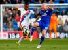 Crystal Palace's Jordan Ayew, left, and Cardiff City's Aron Gunnarsson battle for the ball during their English Premier League soccer match at Cardiff City Stadium, Cardiff, Wales, Saturday May 4, 2019. (Simon Galloway/PA via AP)
