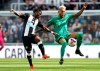 Newcastle United's Christian Atsu, left, and Watford's Roberto Pereyra battle for the ball during the English Premier League soccer match at St James' Park, London, Saturday Aug. 31, 2019. (Owen Humphreys/PA via AP)
