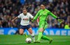 Tottenham Hotspur's Kit Graham, left, and Arsenal's goalie Manuela Zinsberger in action during their Women's Super League soccer match at the Tottenham Hotspur Stadium in London, Sunday Nov. 17, 2019. The match drew a record crowd of 38,262 for the competition on Sunday when Arsenal claimed a 2-0 victory at Tottenham. (Zac Goodwin/PA via AP)