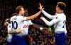 Tottenham Hotspur's Harry Kane, left, celebrates with teammates after scoring his side's first goal of the game against Cardiff, during their English Premier League soccer match at Cardiff City Stadium in Cardiff, Wales, Tuesday Jan. 1, 2019. (Mark Kerton/PA via AP)