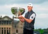 Victor Perez shows off the trophy following his win of the Links Championship at St Andrews in Scotland, Sunday Sept. 29, 2019. (Kenny Smith/PA via AP)