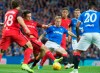 Rangers Scott Arfield, centre, in action against Danish team Midtjylland players during their Europa League Third Qualifying Round Second Leg soccer match at Ibrox Stadium in Glasgow, Scotland, Thursday Aug. 15, 2019. (Jeff Holmes/PA via AP)