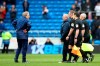 Cardiff City manager Neil Warnock, left, stands on the pitch after Chelsea won the match 2-1, during the English Premier League soccer match at the Cardiff City Stadium in Cardiff, Wales, Sunday March 31, 2019. (Nick Potts/PA via AP)