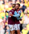 Aston Villa's Conor Hourihane, right, celebrates scoring against Norwich City during the English Premier League soccer match at Carrow Road, Norwich, England, Saturday Oct. 5, 2019. (Joe Giddens/PA via AP)