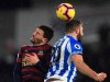 Newcastle United's Fabian Schar,left, and Huddersfield Town's Laurent Depoitre battle for the ball during the English Premier League soccer match between Huddersfield Town and Newcastle at the John Smith‚Äôs stadium, Huddersfield, England. Saturday Dec. 15, 2018. (Mike Egerton/PA via AP)