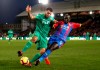 Watford's Troy Deeney, left, and Crystal Palace's Mamadou Sakho fight for the ball during the English Premier League soccer match between Crystal Palace and Watford Town at the Selhurst Park stadium, London. Saturday, Jan. 12, 2019 (John Walton/PA via AP)