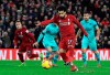 Liverpool's Mohamed Salah scores his side's fourth goal of the game against Arsenal, during their English Premier League soccer match at Anfield Stadium in Liverpool, England, Saturday Dec. 29, 2018. (Peter Byrne/PA via AP)