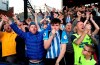 Huddersfield Town fans applaud their team after their relegation was confirmed after the English Premier League soccer match between Crystal Palace and Huddersfield Town at the Selhurst Park stadium, London. Saturday, March. 30, 2019 (Isabel Infantes/PA via AP)