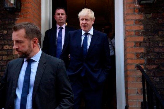 Kirsty O'Connor / The Associated PressConservative Party leadership contender Boris Johnson, right, leaves his office in London, Monday July 22, 2019. Voting closes Monday in the ballot to elect Britain's next prime minister, from the two contenders Jeremy Hunt and Boris Johnson, as critics of likely winner Boris Johnson condemned his vow to take Britain out of the European Union with or without a Brexit deal.(Kirsty O'Connor/PA via AP)